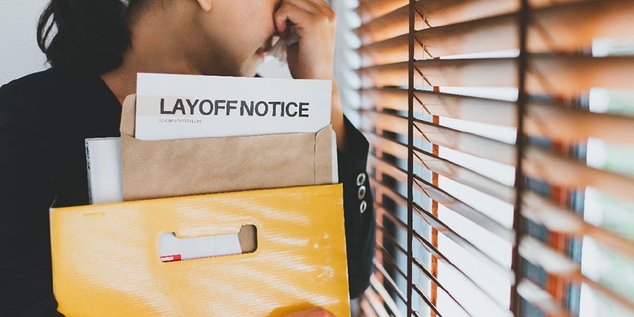 Woman with Layoff Notice
