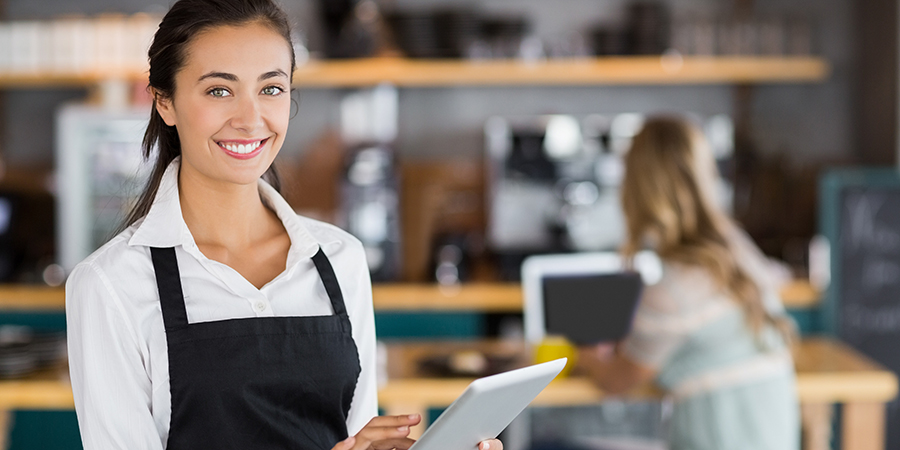 A server calculating her tips